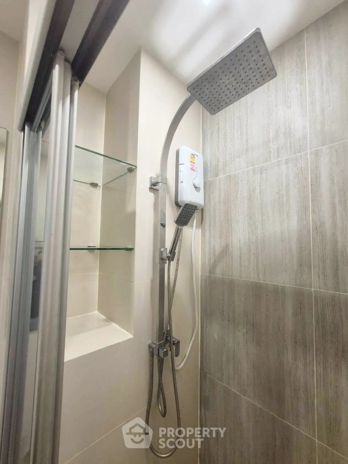 Modern bathroom shower with glass shelves and sleek design