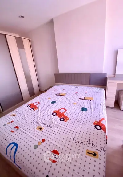 Charming bedroom with playful decor and ample storage in modern apartment.