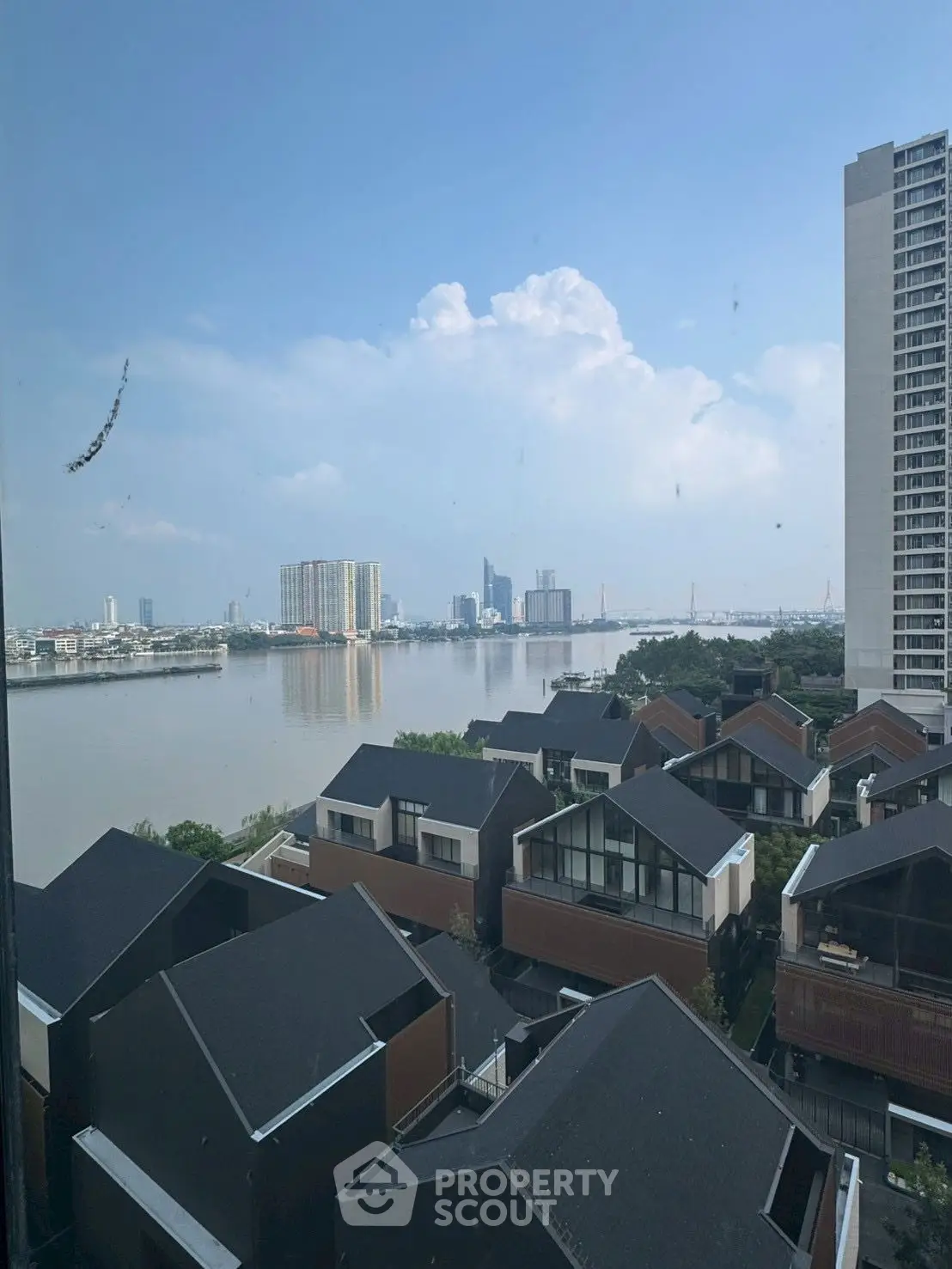 Stunning river view from high-rise building, perfect for urban living enthusiasts.