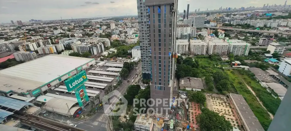 Stunning aerial view of urban landscape with high-rise buildings and lush greenery