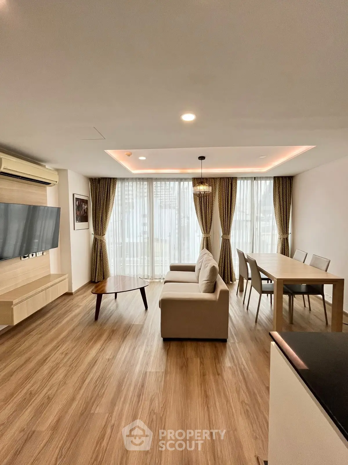 Spacious modern living room with elegant decor and natural light