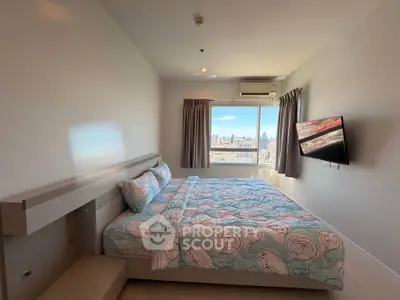 Spacious bedroom with city view and modern decor