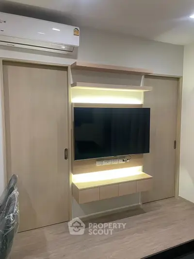 Modern living room with sleek TV unit and ambient lighting