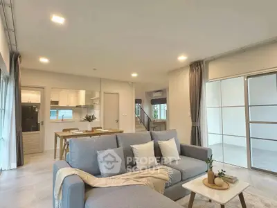 Spacious modern living room with open kitchen and stylish decor