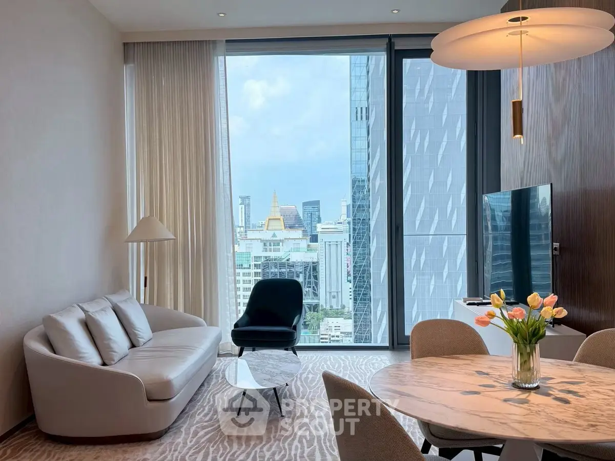 Luxurious living room with stunning city view, modern furniture, and elegant decor in high-rise apartment.