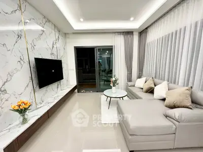 Modern living room with marble accent wall and sleek furniture