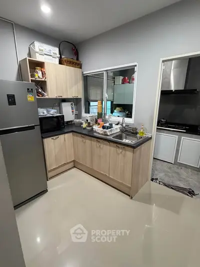 Modern kitchen with sleek cabinets and stainless steel appliances