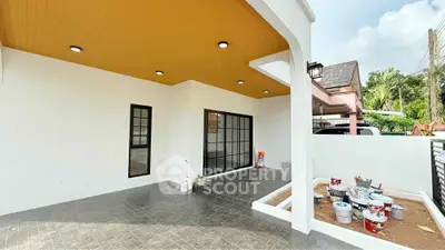 Modern patio with sleek design and vibrant ceiling, perfect for outdoor relaxation.