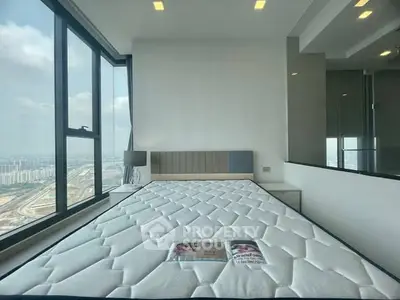 Spacious bedroom with panoramic city view and modern design