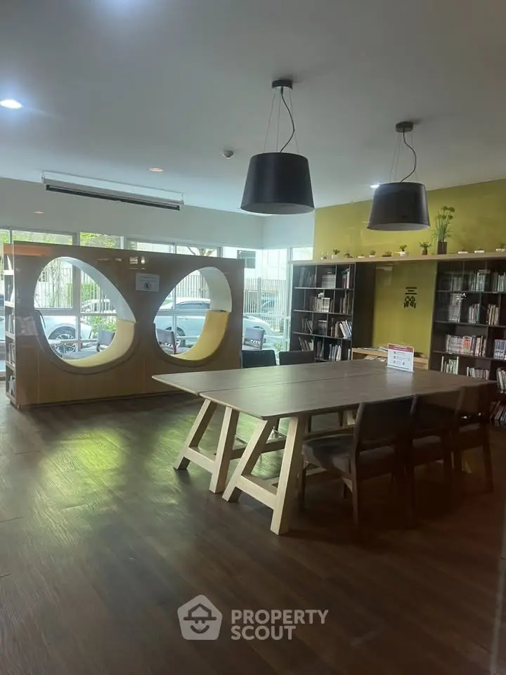 Modern library with stylish wooden furniture and unique circular bookshelf design