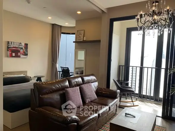 Stylish modern living room with leather sofa and balcony view in urban apartment