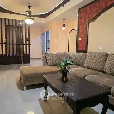Spacious living room with elegant decor and cozy seating area