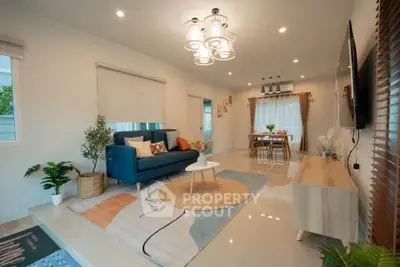 Spacious modern living room with stylish decor and dining area