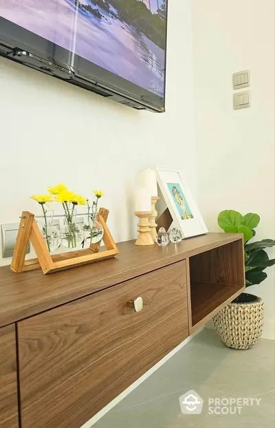 Stylish modern living room with wooden console and decorative elements