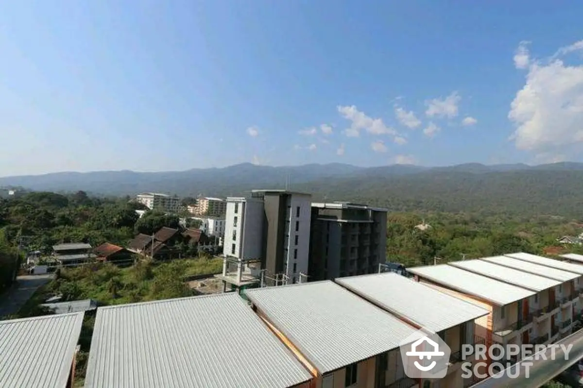 Stunning mountain view from modern apartment building rooftop