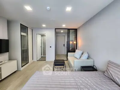 Modern studio apartment with sleek design and cozy furnishings