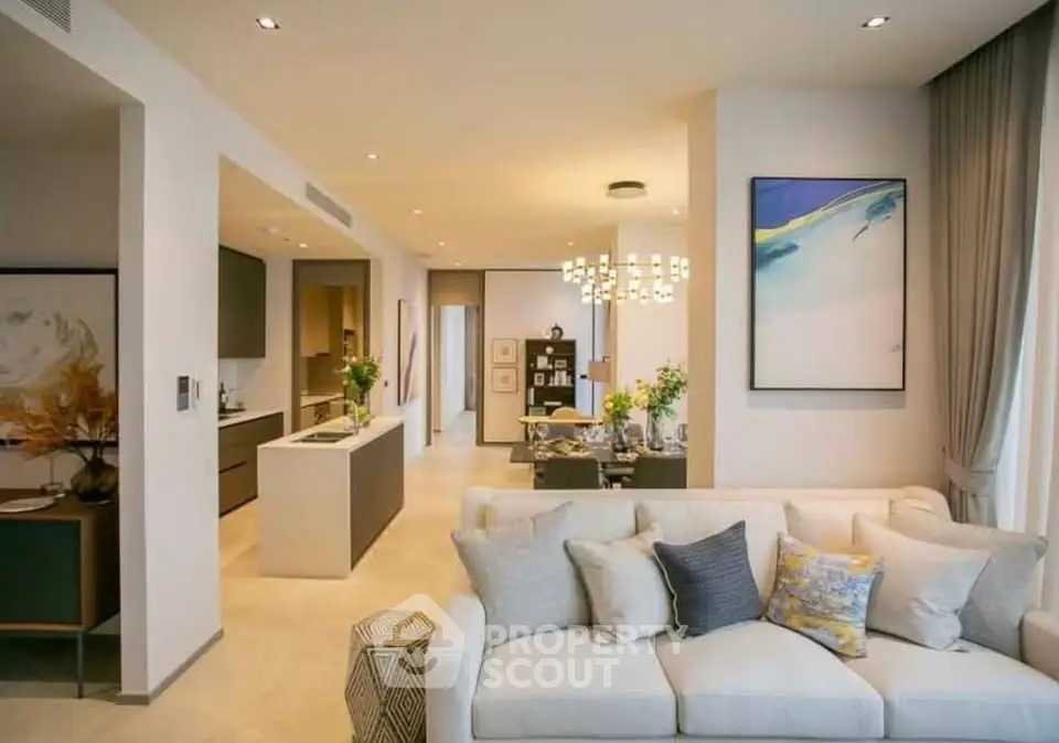 Luxurious open-plan living room with modern kitchen and elegant decor