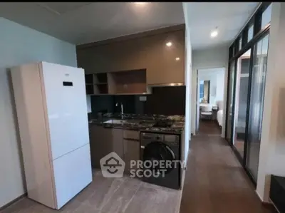 Modern kitchen with sleek appliances and open layout in stylish apartment