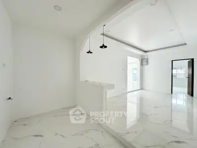 Spacious modern interior with sleek marble flooring and open layout design.