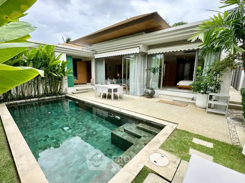 Luxurious villa with private pool and lush garden, perfect for tropical living.