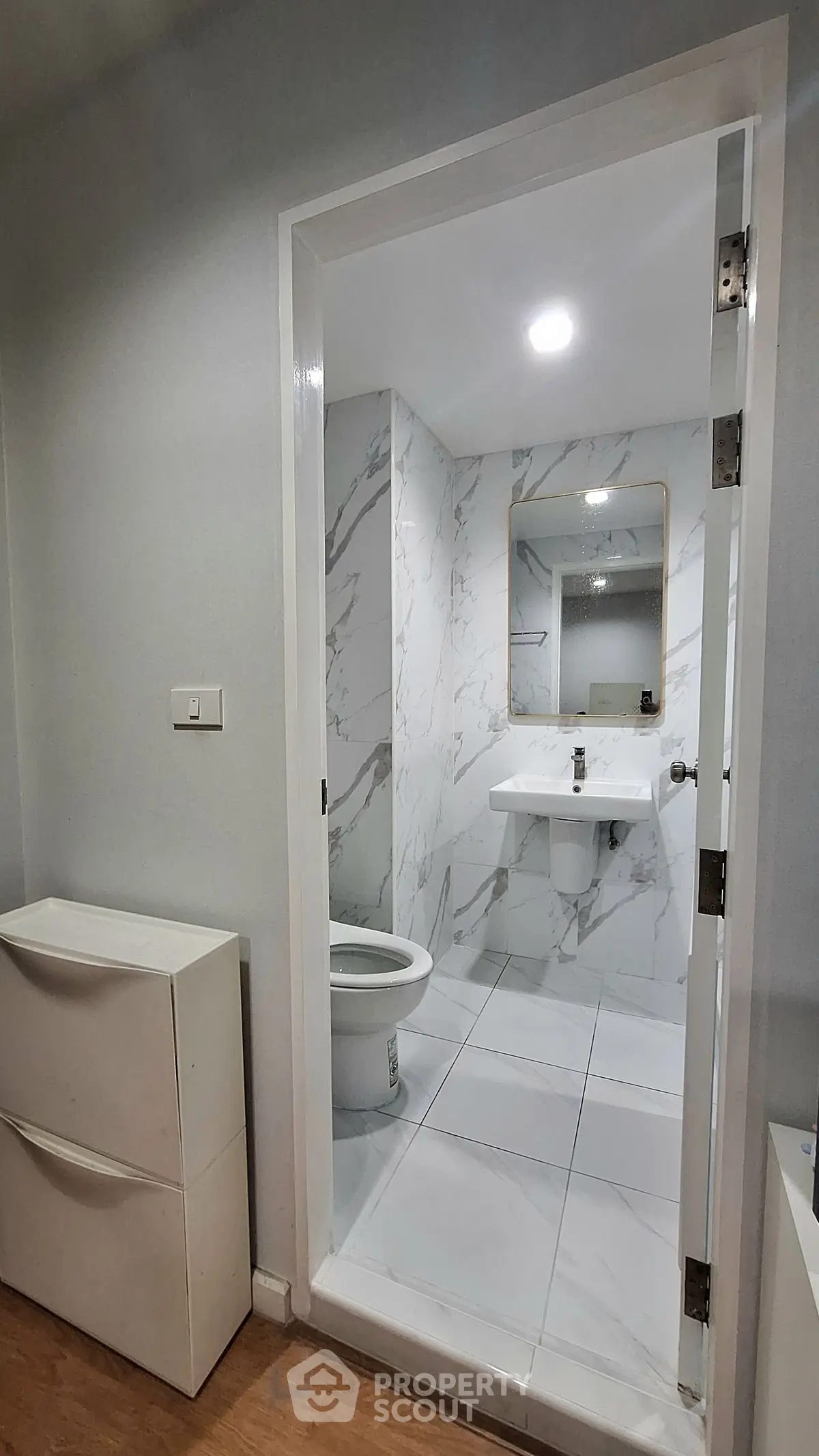 Modern bathroom with marble tiles and sleek design