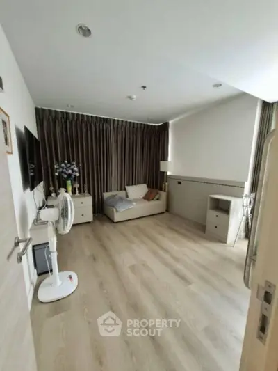 Spacious living room with modern decor and natural light