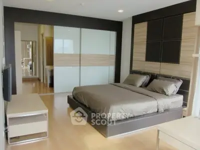 Modern bedroom with sleek design and ample natural light