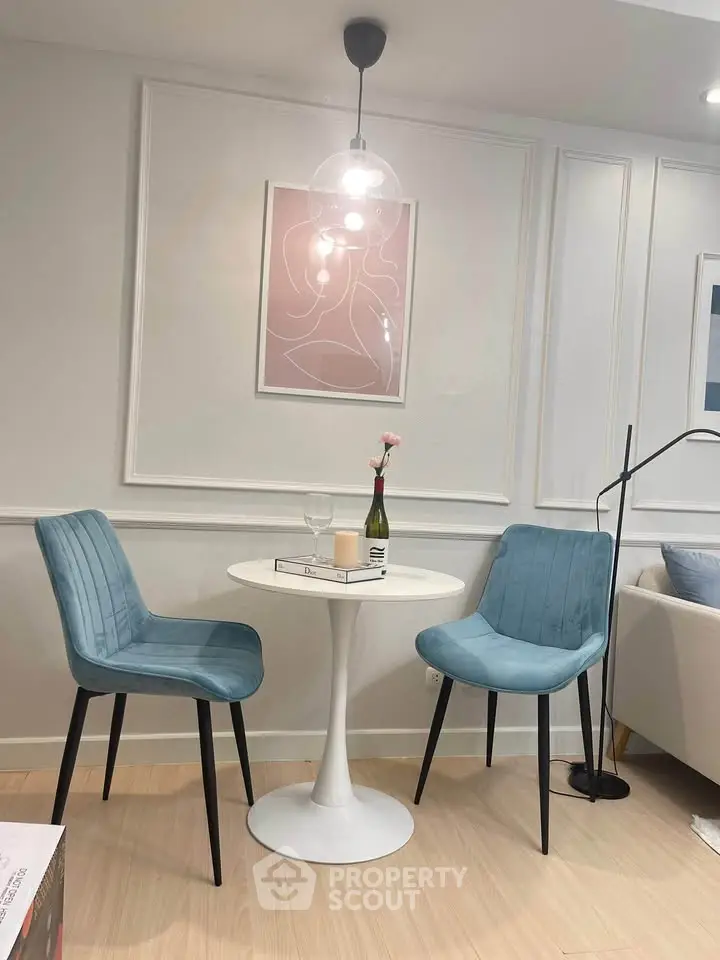 Chic modern dining nook with stylish chairs and elegant decor in a cozy living space.