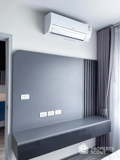 Modern minimalist interior with air conditioner and sleek wall unit