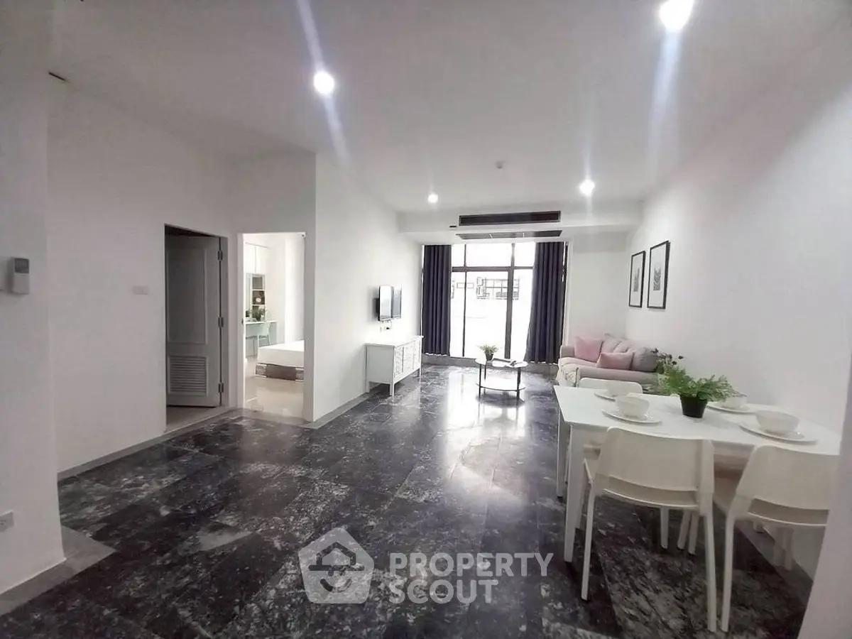 Spacious modern living room with dining area and stylish decor