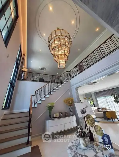 Luxurious modern living room with elegant chandelier and stylish decor