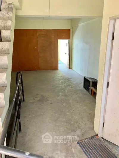 Spacious unfinished interior with potential for customization and renovation.