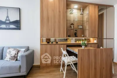 Stylish living room with modern wooden cabinetry and cozy seating area.