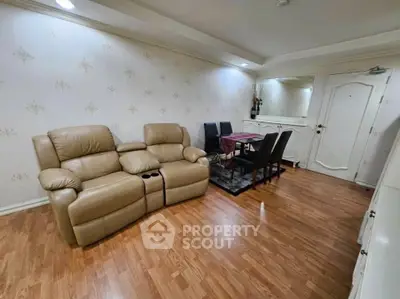 Spacious living room with elegant decor and comfortable seating in a modern apartment.