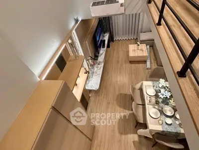 Modern loft-style living room with dining area and stylish decor