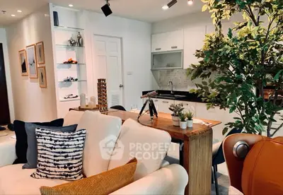 Stylish open-plan living room with modern kitchen and cozy decor