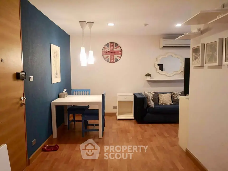 Charming living room with modern decor and cozy seating area, perfect for relaxation and entertaining.