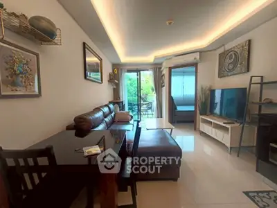 Modern living room with stylish decor and balcony view in a cozy apartment.
