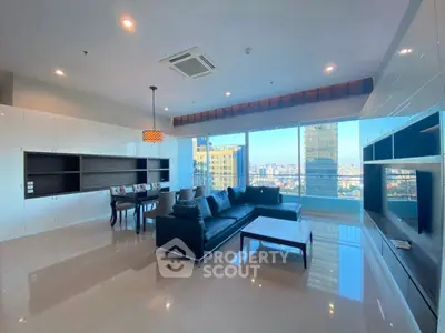 Spacious modern living room with stunning city view and sleek furnishings