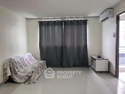 Spacious living room with modern air conditioning and natural light