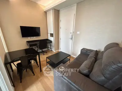 Modern living room with sleek furniture and wall-mounted TV