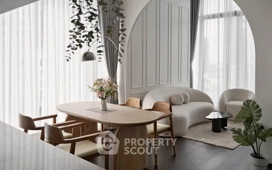 Elegant modern living room with stylish furniture and large windows, perfect for urban living.