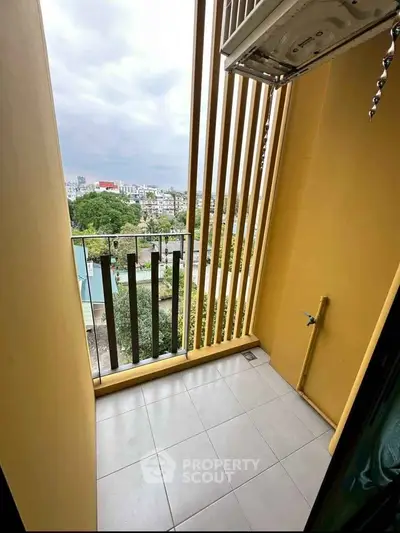 Charming balcony with city view and modern design, perfect for relaxation.