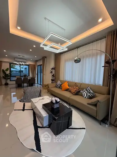 Luxurious modern living room with elegant decor and stylish lighting, perfect for sophisticated living.