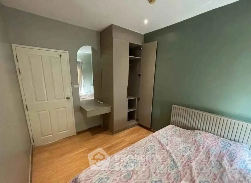 Cozy bedroom with built-in wardrobe and stylish decor