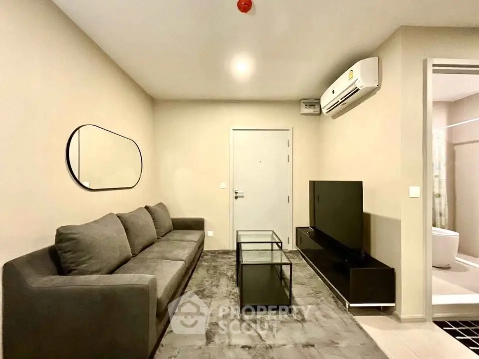 Modern living room with sleek furniture and air conditioning