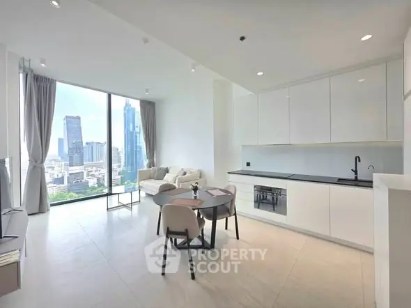 Modern open-plan living room with city view, sleek kitchen, and elegant furnishings in a high-rise apartment.
