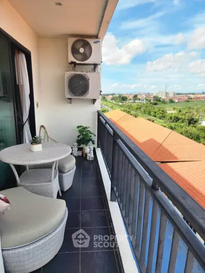 Charming balcony with seating and scenic view, perfect for relaxation and enjoying the outdoors.