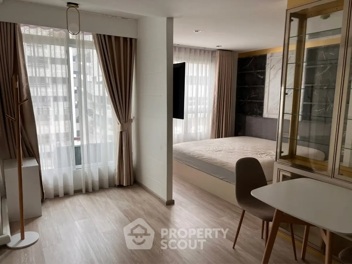 Modern studio apartment with elegant decor and natural light