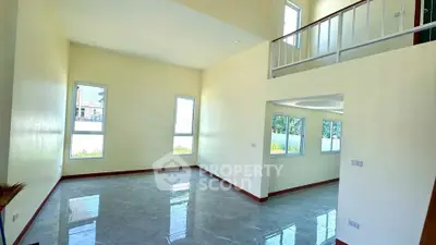 Spacious modern living room with high ceilings and natural light